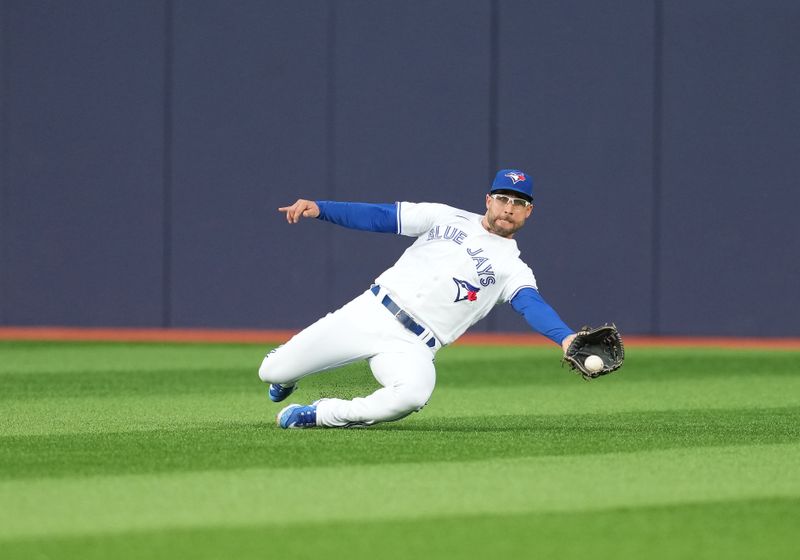 May 12, 2023; Toronto, Ontario, CAN; Toronto Blue Jays center fielder Kevin Kiermaier (39) catches a fly ball against the Atlanta Braves during the third inning at Rogers Centre. Mandatory Credit: Nick Turchiaro-USA TODAY Sports