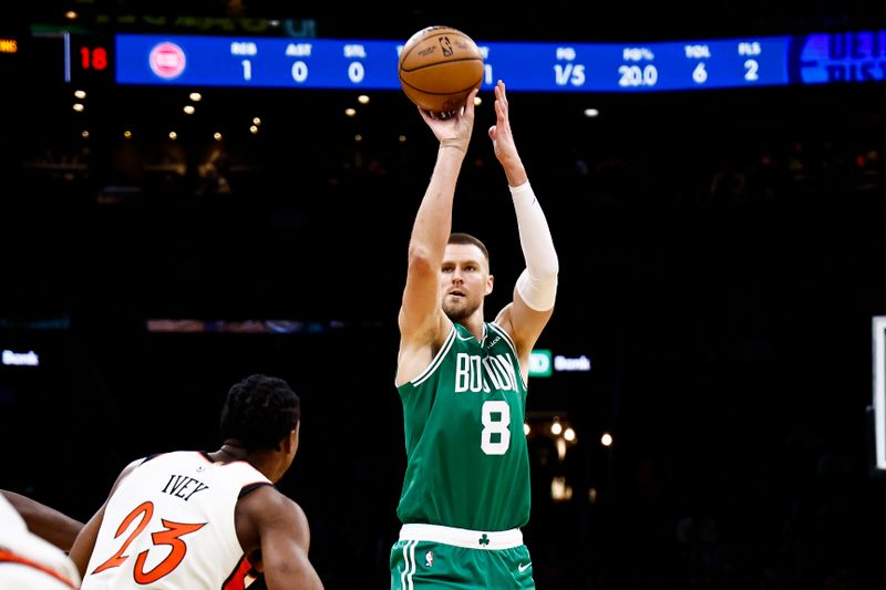 BOSTON, MA - DECEMBER 4: Kristaps Porzingis #8 of the Boston Celtics shoots over Jaden Ivey #23 of the Detroit Pistons during the first quarter at TD Garden on December 4, 2024 in Boston, Massachusetts. NOTE TO USER: User expressly acknowledges and agrees that, by downloading and/or using this Photograph, user is consenting to the terms and conditions of the Getty Images License Agreement. (Photo By Winslow Townson/Getty Images)