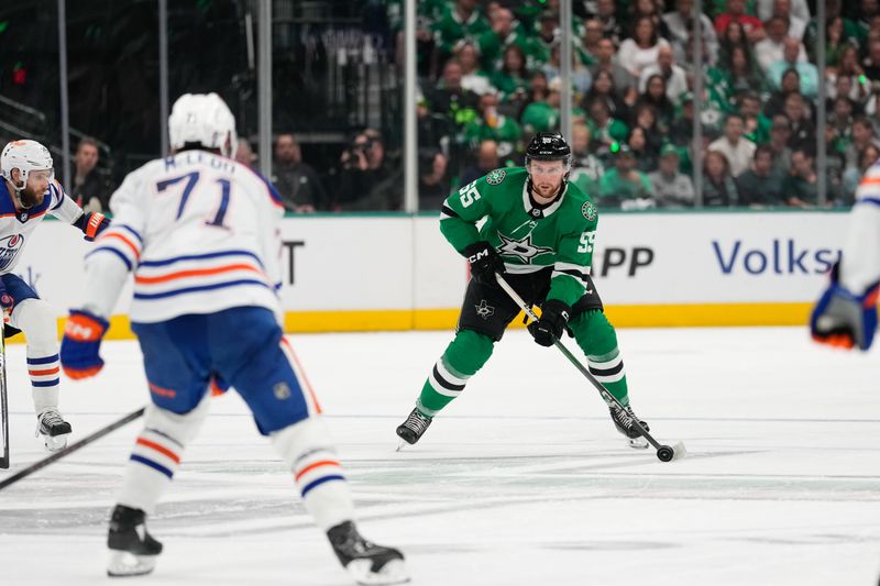 May 31, 2024; Dallas, Texas, USA; Dallas Stars defenseman Thomas Harley (55) looks to pass against Edmonton Oilers center Ryan McLeod (71) during the second period between the Dallas Stars and the Edmonton Oilers in game five of the Western Conference Final of the 2024 Stanley Cup Playoffs at American Airlines Center. Mandatory Credit: Chris Jones-USA TODAY Sports