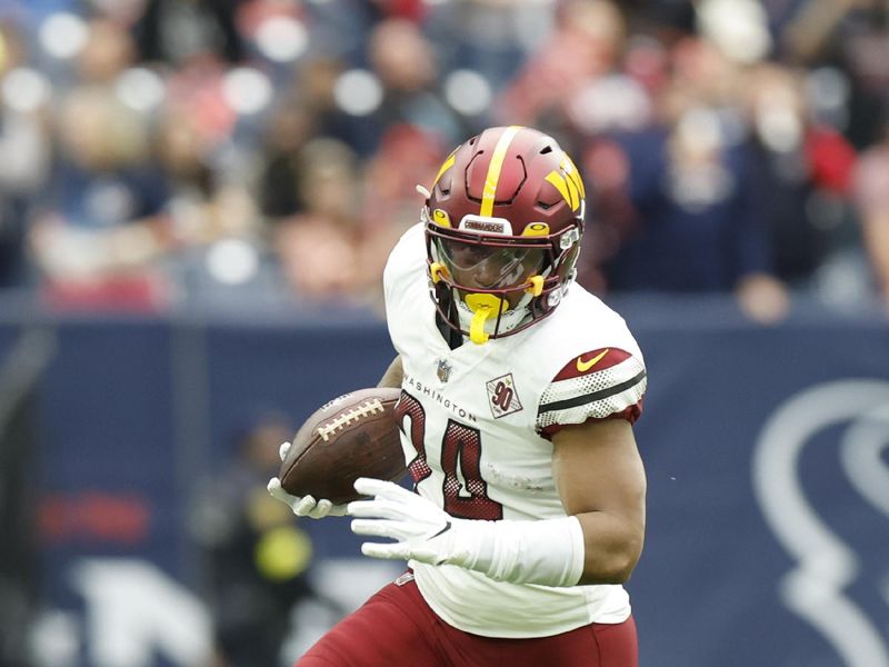 Washington Commanders running back Antonio Gibson (24) carries the ball during an NFL game against the Houston Texans on Sunday, November 20, 2022, in Houston. (AP Photo/Matt Patterson)