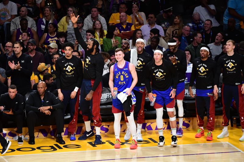 LOS ANGELES, CA - APRIL 25: Denver Nuggets celebrate during the game against the Los Angeles Lakers during Round One Game Three of the 2024 NBA Playoffs on April 25, 2024 at Crypto.Com Arena in Los Angeles, California. NOTE TO USER: User expressly acknowledges and agrees that, by downloading and/or using this Photograph, user is consenting to the terms and conditions of the Getty Images License Agreement. Mandatory Copyright Notice: Copyright 2024 NBAE (Photo by Adam Pantozzi/NBAE via Getty Images)