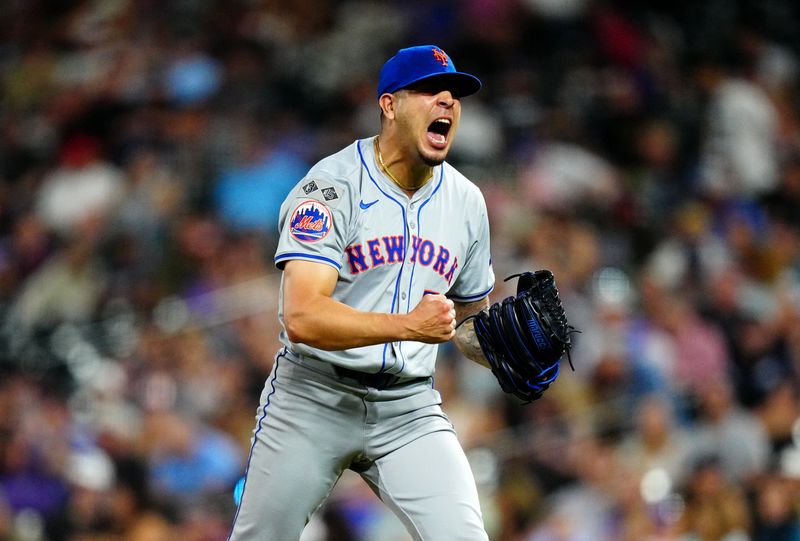Aug 7, 2024; Denver, Colorado, USA; New York Mets pitcher Jose Butto (70) reacts to striking out the Colorado Rockies during the seventh inning at Coors Field. Mandatory Credit: Ron Chenoy-USA TODAY Sports