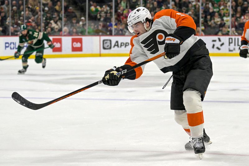 Jan 12, 2024; Saint Paul, Minnesota, USA; Philadelphia Flyers defenseman Jamie Drysdale (9) takes a shot on goal against the Minnesota Wild during the first period at Xcel Energy Center. Mandatory Credit: Nick Wosika-USA TODAY Sports