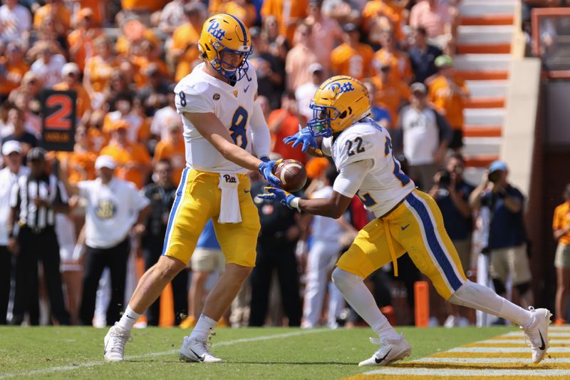 Sep 11, 2021; Knoxville, Tennessee, USA; Pittsburgh Panthers quarterback Kenny Pickett (8) hands the ball off to running back Vincent Davis (22) during the first quarter against the Tennessee Volunteers at Neyland Stadium. Mandatory Credit: Randy Sartin-USA TODAY Sports