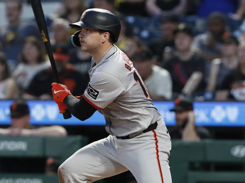 May 22, 2024; Pittsburgh, Pennsylvania, USA; San Francisco Giants catcher Patrick Bailey (14) hits a single  against the Pittsburgh Pirates during the sixth inning at PNC Park. Mandatory Credit: Charles LeClaire-USA TODAY Sports