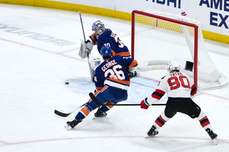 Nov 9, 2024; Elmont, New York, USA; New York Islanders goaltender Ilya Sorokin (30) makes a save against the New Jersey Devils during the first period at UBS Arena. Mandatory Credit: John Jones-Imagn Images