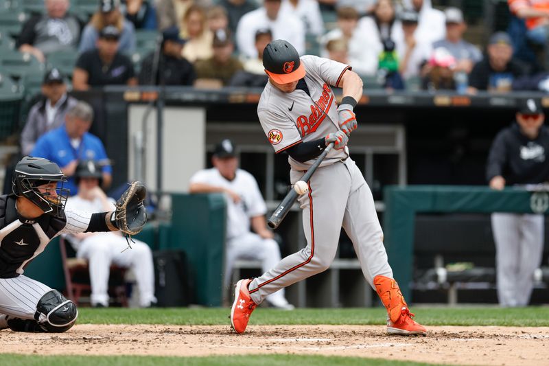 May 26, 2024; Chicago, Illinois, USA; Baltimore Orioles first baseman Ryan Mountcastle (6) hits a double against the Chicago White Sox during the fourth inning at Guaranteed Rate Field. Mandatory Credit: Kamil Krzaczynski-USA TODAY Sports