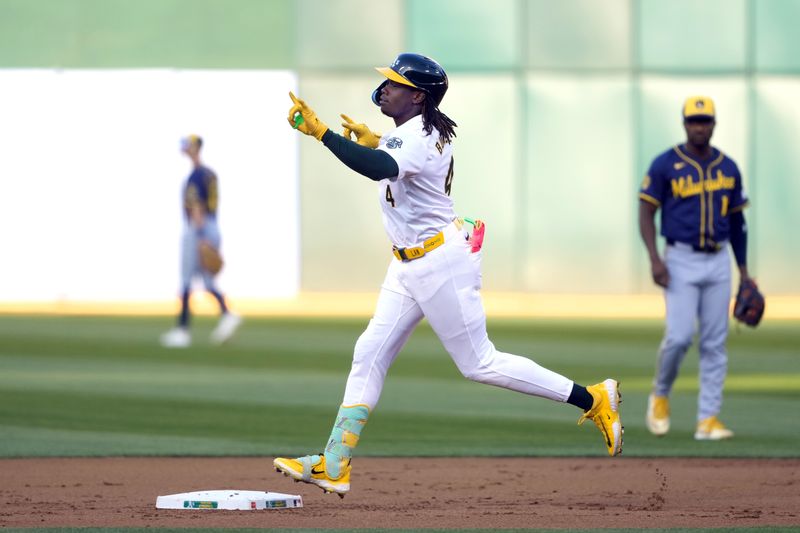 Aug 23, 2024; Oakland, California, USA; Oakland Athletics right fielder Lawrence Butler (4) gestures while rounding the bases after hitting a home run against the Milwaukee Brewers during the first inning at Oakland-Alameda County Coliseum. Mandatory Credit: Darren Yamashita-USA TODAY Sports