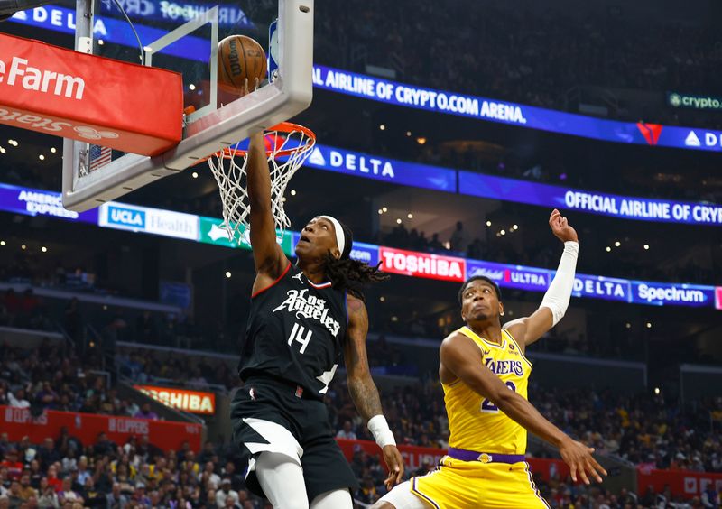 LOS ANGELES, CALIFORNIA - FEBRUARY 28:  Terance Mann #14 of the LA Clippers takes a shot against Rui Hachimura #28 of the Los Angeles Lakers in the first half at Crypto.com Arena on February 28, 2024 in Los Angeles, California.  NOTE TO USER: User expressly acknowledges and agrees that, by downloading and/or using this photograph, user is consenting to the terms and conditions of the Getty Images License Agreement.  (Photo by Ronald Martinez/Getty Images)