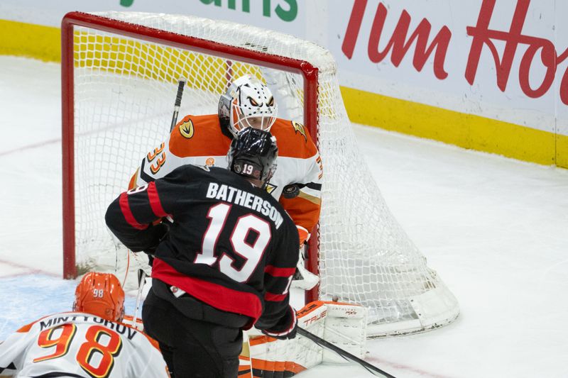 Mar 14, 2026; Ottawa, Ontario, CAN; Anaheim Ducks goalie Ville Husso (33) makes a save on a shot from Ottawa Senators right wing Drake Batherson (19) in the third period at the Canadian Tire Centre. Mandatory Credit: Marc DesRosiers-IMAGN Images