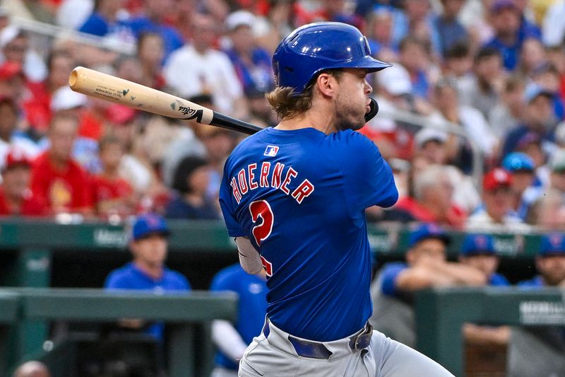 Jul 12, 2024; St. Louis, Missouri, USA;  Chicago Cubs second baseman Nico Hoerner (2) drives in a run as he ground out against the St. Louis Cardinals during the third inning at Busch Stadium. Mandatory Credit: Jeff Curry-USA TODAY Sports