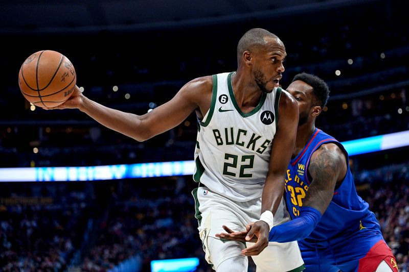 DENVER, CO - MARCH 25:  Khris Middleton #22 of the Milwaukee Bucks is defended by Jeff Green #32 of the Denver Nuggets in the secxond half of a game at Ball Arena on March 25, 2023 in Denver, Colorado. NOTE TO USER: User expressly acknowledges and agrees that, by downloading and or using this photograph, User is consenting to the terms and conditions of the Getty Images License Agreement. (Photo by Dustin Bradford/Getty Images)