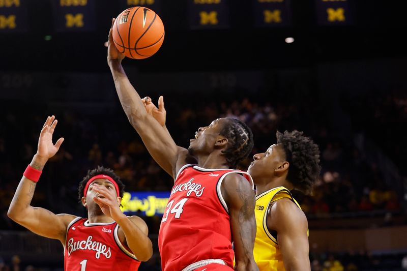 Jan 15, 2024; Ann Arbor, Michigan, USA; Ohio State Buckeyes center Felix Okpara (34) grabs the rebound in the first half against the Michigan Wolverines at Crisler Center. Mandatory Credit: Rick Osentoski-USA TODAY Sports