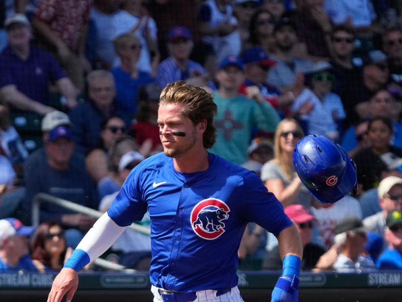 Mar 14, 2024; Mesa, Arizona, USA; Chicago Cubs second baseman Nico Hoerner (2) scores a run against the Oakland Athletics in the first inning at Sloan Park. Mandatory Credit: Rick Scuteri-USA TODAY Sports