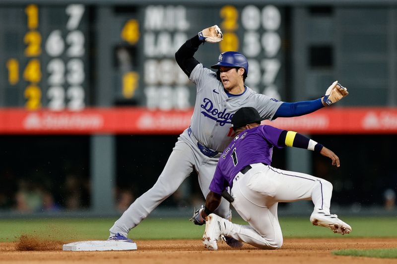 Jun 17, 2024; Denver, Colorado, USA; Los Angeles Dodgers designated hitter Shohei Ohtani (17) safely steals second against Colorado Rockies second baseman Adael Amador (1) in the eighth inning at Coors Field. Mandatory Credit: Isaiah J. Downing-USA TODAY Sports