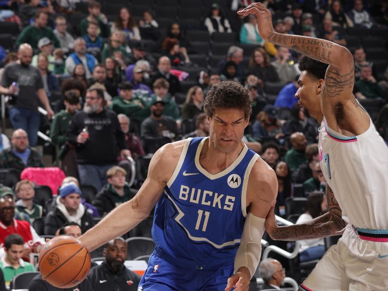 MILWAUKEE, WI - FEBRUARY 23: Brook Lopez #11 of the Milwaukee Bucks drives to the basket during the game against the Miami Heat  on February 23, 2025 at Fiserv Forum Center in Milwaukee, Wisconsin. NOTE TO USER: User expressly acknowledges and agrees that, by downloading and or using this Photograph, user is consenting to the terms and conditions of the Getty Images License Agreement. Mandatory Copyright Notice: Copyright 2025 NBAE (Photo by Gary Dineen/NBAE via Getty Images).