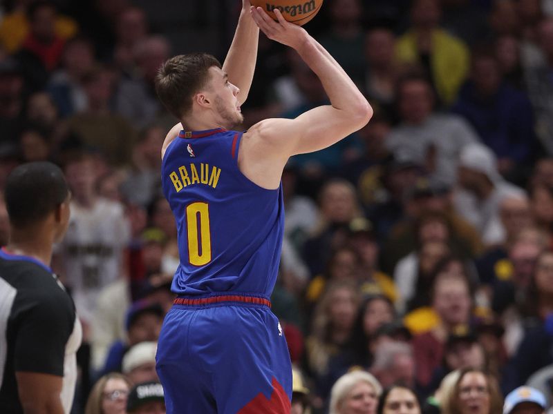 DENVER, COLORADO - JANUARY 05: Christian Braun #0 of the Denver Nuggets puts up a shot against the Orlando Magic in the first quarter at Ball Arena on January 05, 2024 in Denver, Colorado.  NOTE TO USER: User expressly acknowledges and agrees that, by downloading and or using this photograph, User is consenting to the terms and conditions of the Getty Images License Agreement.  (Photo by Matthew Stockman/Getty Images)