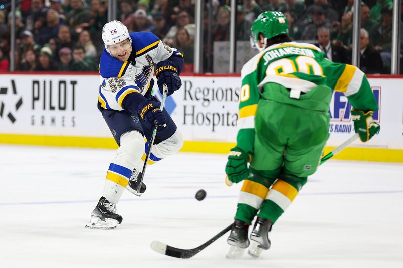 Mar 23, 2024; Saint Paul, Minnesota, USA; St. Louis Blues defenseman Colton Parayko (55) shoots as Minnesota Wild left wing Marcus Johansson (90) defends during the second period at Xcel Energy Center. Mandatory Credit: Matt Krohn-USA TODAY Sports