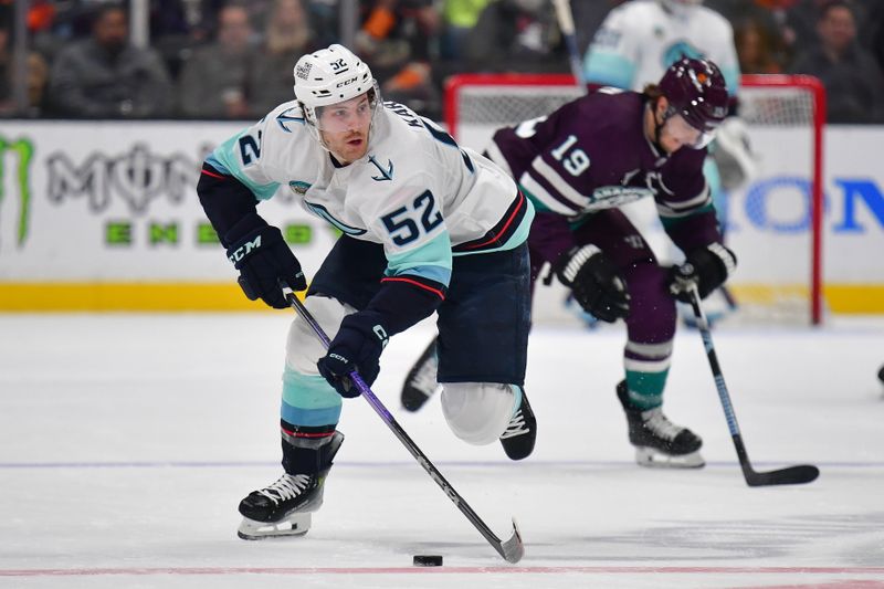 Apr 5, 2024; Anaheim, California, USA; Seattle Kraken left wing Tye Kartye (52) moves the puck against the Anaheim Ducks during the first period at Honda Center. Mandatory Credit: Gary A. Vasquez-USA TODAY Sports