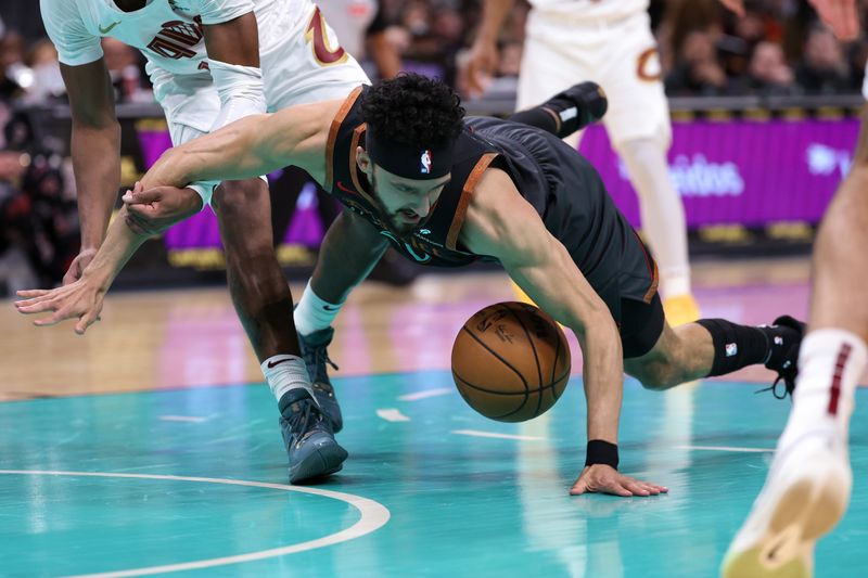 WASHINGTON, DC - FEBRUARY 25: Landry Shamet #20 of the Washington Wizards falls to the court as he tries to grab a loose ball against the Cleveland Cavaliers during the first half at Capital One Arena on February 25, 2024 in Washington, DC. NOTE TO USER: User expressly acknowledges and agrees that, by downloading and or using this photograph, User is consenting to the terms and conditions of the Getty Images License Agreement. (Photo by Patrick Smith/Getty Images)