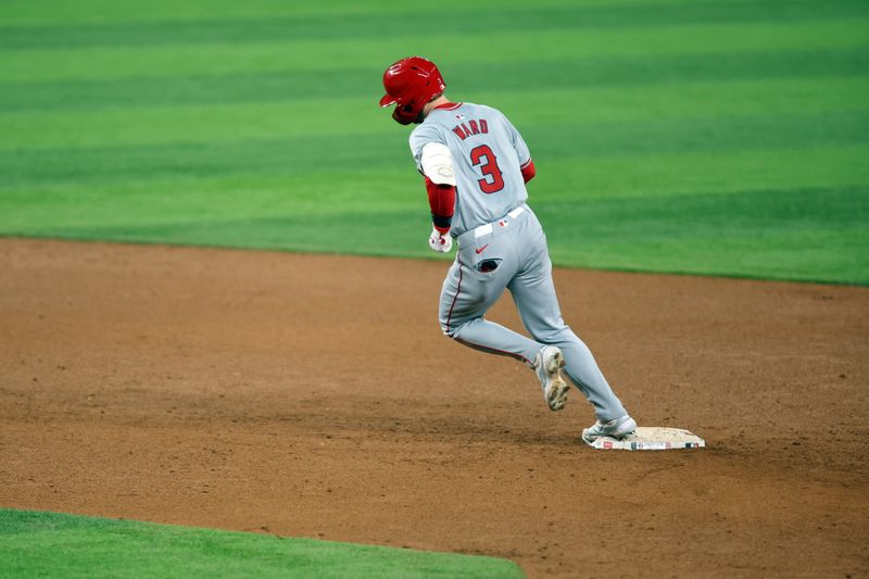 May 17, 2024; Arlington, Texas, USA;  Los Angeles Angels left fielder Taylor Ward (3) rounds second base after hitting a home run in the sixth inning against the Texas Rangers at Globe Life Field. Mandatory Credit: Tim Heitman-USA TODAY Sports