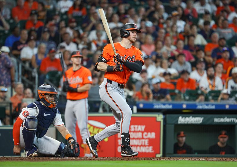 Jun 22, 2024; Houston, Texas, USA; Baltimore Orioles left fielder Ryan O'Hearn (32) hits a single during the third inning against the Houston Astros at Minute Maid Park. Mandatory Credit: Troy Taormina-USA TODAY Sports