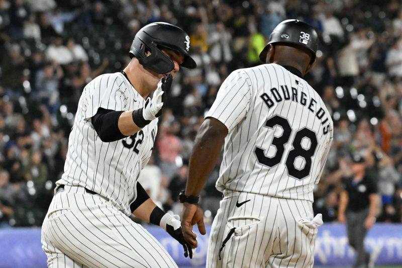 Jun 7, 2024; Chicago, Illinois, USA;  Chicago White Sox outfielder Gavin Sheets (32) hi fives  first base coach/outfield coach Jason Bourgeois (38) after he hits a home run against the Boston Red Sox during the sixth inning at Guaranteed Rate Field. Mandatory Credit: Matt Marton-USA TODAY Sports