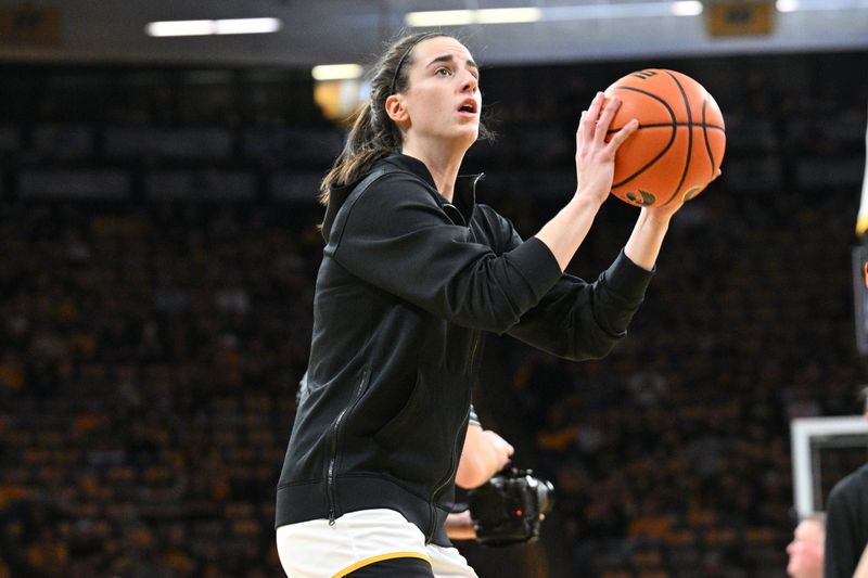 Mar 3, 2024; Iowa City, Iowa, USA; Iowa Hawkeyes guard Caitlin Clark (22) warms up before the game against the Ohio State Buckeyes at Carver-Hawkeye Arena. Clark is attempting to break the NCAA basketball all-time scoring record. Mandatory Credit: Jeffrey Becker-USA TODAY Sports