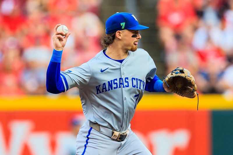 Aug 16, 2024; Cincinnati, Ohio, USA; Kansas City Royals shortstop Bobby Witt Jr. (7) throws to first in attempt to get Cincinnati Reds designated hitter Jeimer Candelario (not pictured) out in the second inning at Great American Ball Park. Mandatory Credit: Katie Stratman-USA TODAY Sports