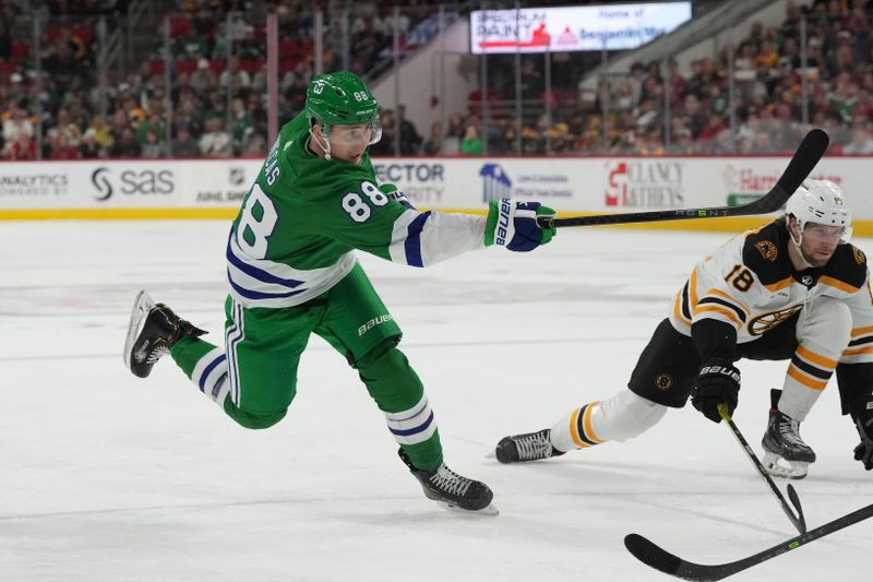 Mar 26, 2023; Raleigh, North Carolina, USA;  Carolina Hurricanes center Martin Necas (88) takes a shot against the Boston Bruins during the first period at PNC Arena. Mandatory Credit: James Guillory-USA TODAY Sports