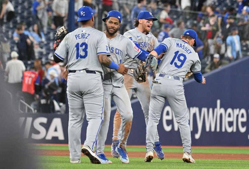 Apr 30, 2024; Toronto, Ontario, CAN;   Kansas City Royals first baseman Salvador Perez (13) and left fielder MJ Melendez (1) and shortstop Bobby Witt Jr. (7) and second baseman Michael Massey (19) celebrate a win over the Toronto Blue Jays at Rogers Centre. Mandatory Credit: Dan Hamilton-USA TODAY Sports