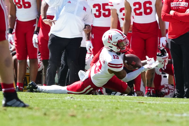 Sep 9, 2023; Boulder, Colorado, USA; Nebraska Cornhuskers defensive back Malcolm Hartzog (13) pulls in a pass in the third quarter against the Colorado Buffaloes at Folsom Field. Mandatory Credit: Ron Chenoy-USA TODAY Sports