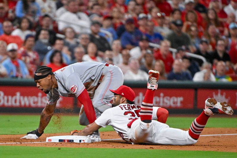 Sep 29, 2023; St. Louis, Missouri, USA;  Cincinnati Reds left fielder Will Benson (30) reacts after sliding safely past St. Louis Cardinals third baseman Jose Fermin (35) for a one run triple during the second inning at Busch Stadium. Mandatory Credit: Jeff Curry-USA TODAY Sports