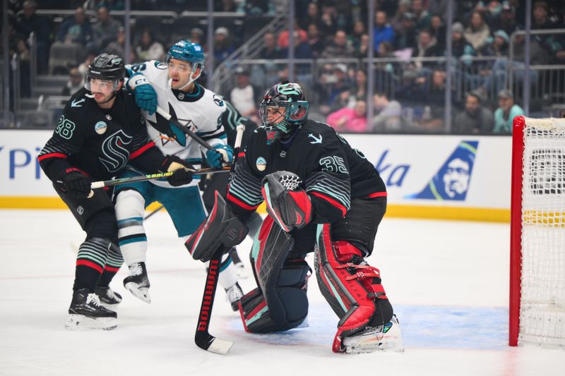 Nov 5, 2025; Seattle, Washington, USA; Seattle Kraken goaltender Joey Daccord (35) defends the goal against the San Jose Sharks during the first period at Climate Pledge Arena. Mandatory Credit: Steven Bisig-Imagn Images