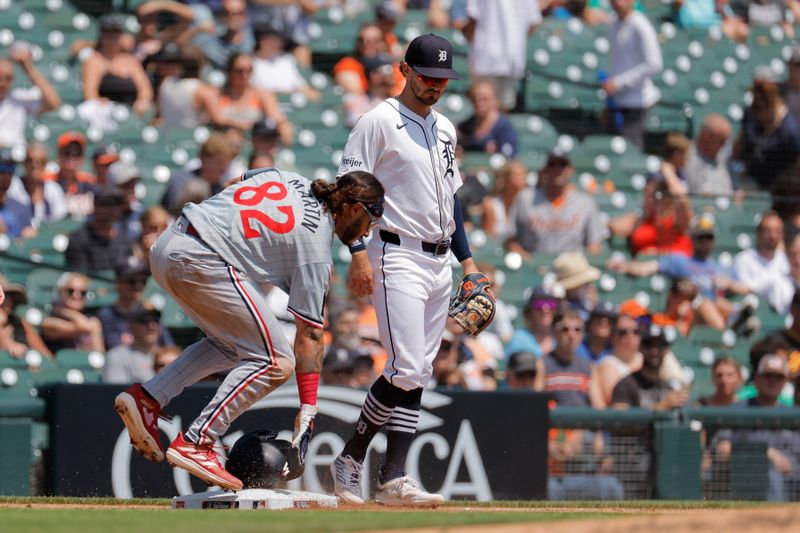 Jul 28, 2024; Detroit, Michigan, USA;  Minnesota Twins left fielder Austin Martin (82) slide in safe at third in the third inning against the Detroit Tigers at Comerica Park. Mandatory Credit: Rick Osentoski-USA TODAY Sports