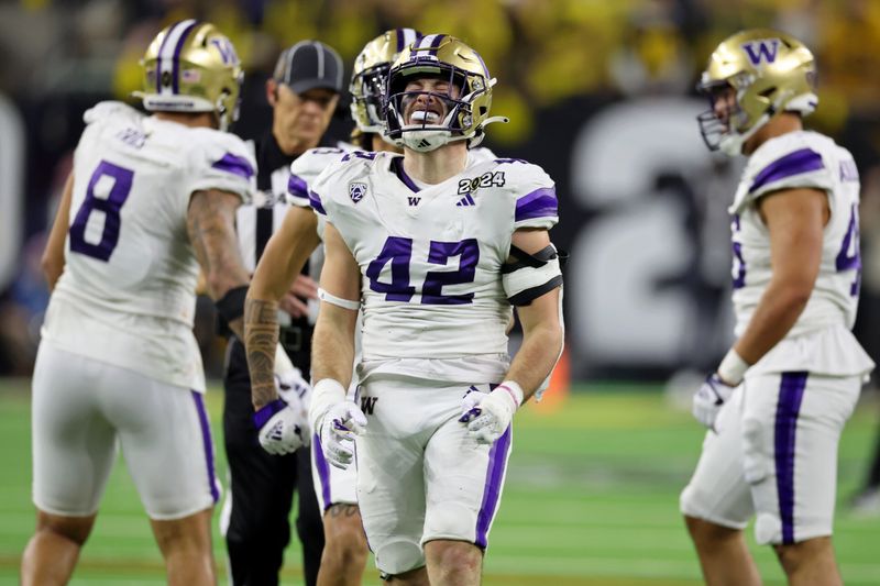 Jan 8, 2024; Houston, TX, USA; Washington Huskies linebacker Carson Bruener (42) reacts after a play against the Michigan Wolverines during the third quarter in the 2024 College Football Playoff national championship game at NRG Stadium. Mandatory Credit: Thomas Shea-USA TODAY Sports