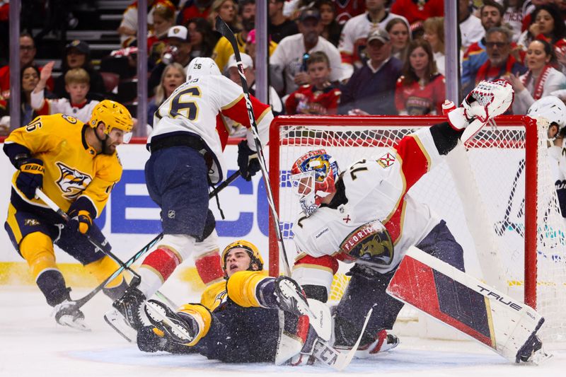 Mar 21, 2024; Sunrise, Florida, USA; Florida Panthers goaltender Sergei Bobrovsky (72) defends his net from Nashville Predators right wing Luke Evangelista (77) during the first period at Amerant Bank Arena. Mandatory Credit: Sam Navarro-USA TODAY Sports