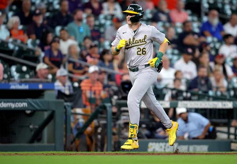 Sep 12, 2024; Houston, Texas, USA; Oakland Athletics first baseman Tyler Nevin (26) jogs towards home plate after hitting a home run against the Houston Astros during the ninth inning at Minute Maid Park. Mandatory Credit: Erik Williams-Imagn Images