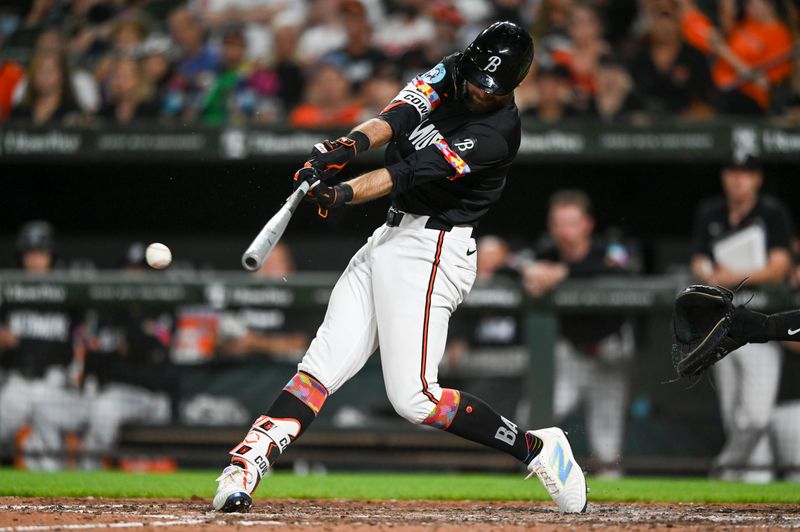 Jul 26, 2024; Baltimore, Maryland, USA;  Baltimore Orioles outfielder Colton Cowser (17) hits a eighth inning single against the San Diego Padres at Oriole Park at Camden Yards. Mandatory Credit: Tommy Gilligan-USA TODAY Sports