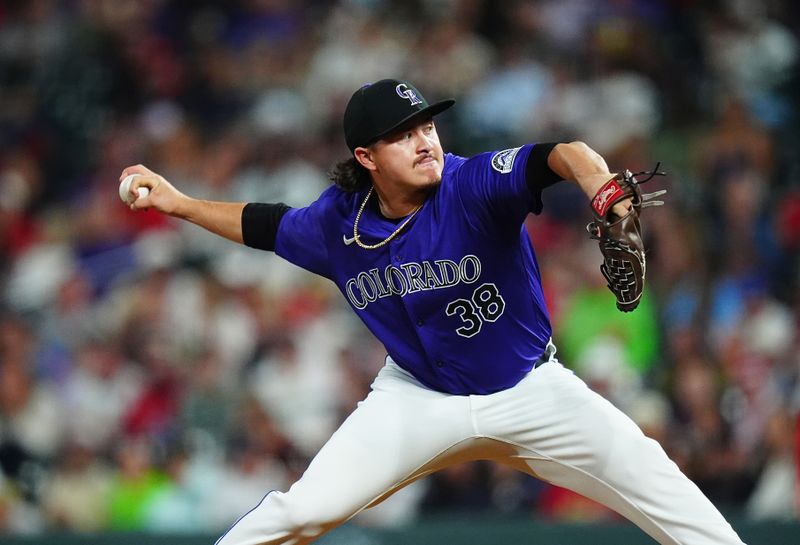 Sep 24, 2024; Denver, Colorado, USA; Colorado Rockies relief pitcher Victor Vodnik (38) pitches in the seventh inning against the St. Louis Cardinals at Coors Field. Mandatory Credit: Ron Chenoy-Imagn Images