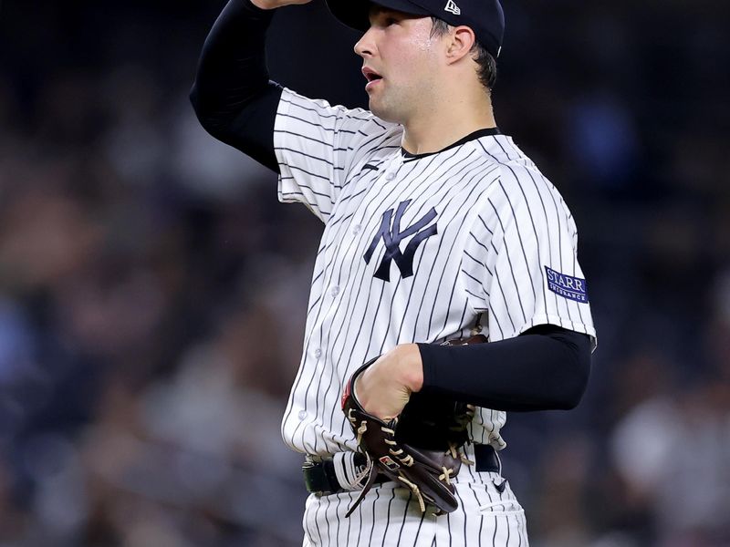 Sep 20, 2023; Bronx, New York, USA; New York Yankees relief pitcher Tommy Kahnle (41) reacts during the eighth inning against the Toronto Blue Jays at Yankee Stadium. Mandatory Credit: Brad Penner-USA TODAY Sports