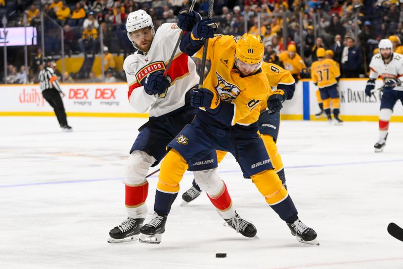 Feb 25, 2025; Nashville, Tennessee, USA;  Florida Panthers left wing A.J. Greer (10) and Nashville Predators center Jonathan Marchessault (81) battle for the puck during the third half at Bridgestone Arena. Mandatory Credit: Steve Roberts-Imagn Images