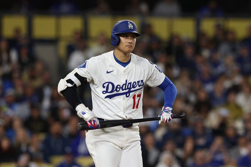 Apr 28, 2025; Los Angeles, California, USA; Los Angeles Dodgers two-way player Shohei Ohtani (17) reacts in the third inning against the Miami Marlins at Dodger Stadium. Mandatory Credit: Jason Parkhurst-Imagn Images