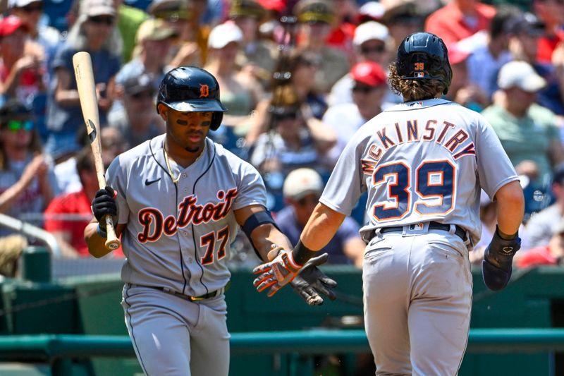 May 21, 2023; Washington, District of Columbia, USA; Detroit Tigers third baseman Zach McKinstry (39) is congratulated by second baseman Andy Ibanez (77) after scoring during the third inning at Nationals Park. Mandatory Credit: Brad Mills-USA TODAY Sports