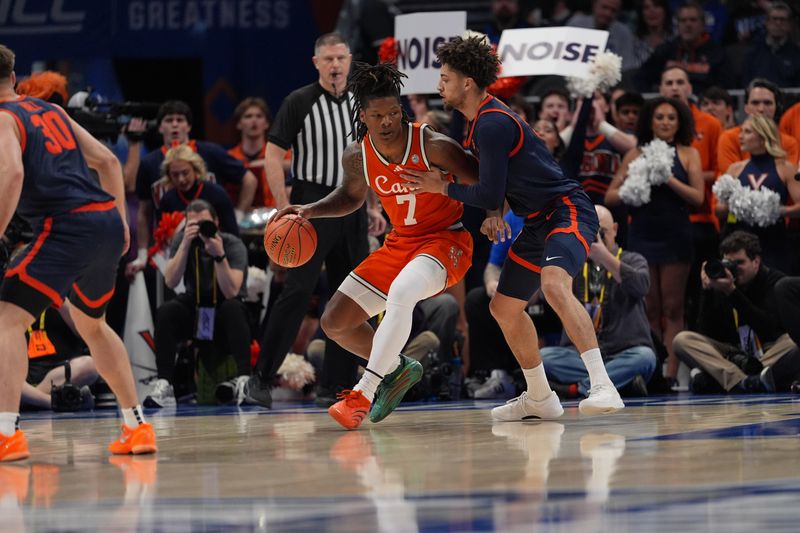Mar 13, 2026; Charlotte, NC, USA; Miami (FL) Hurricanes forward Shelton Henderson (7) moves the ball against Virginia Cavaliers guard Sam Lewis (5) during the first half at Spectrum Center. Mandatory Credit: Jim Dedmon-Imagn Images