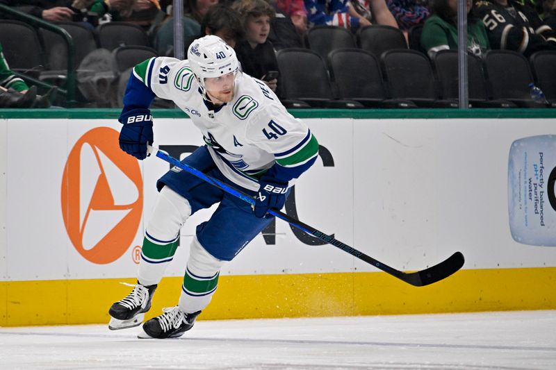 Jan 31, 2025; Dallas, Texas, USA; Vancouver Canucks center Elias Pettersson (40) skates against the Dallas Stars during the second period at the American Airlines Center. Mandatory Credit: Jerome Miron-Imagn Images