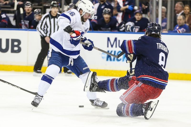 Feb 7, 2024; New York, New York, USA; Tampa Bay Lightning right wing Nikita Kucherov (86) collides with New York Rangers defenseman Jacob Trouba (8) in the third period at Madison Square Garden. Mandatory Credit: Wendell Cruz-USA TODAY Sports