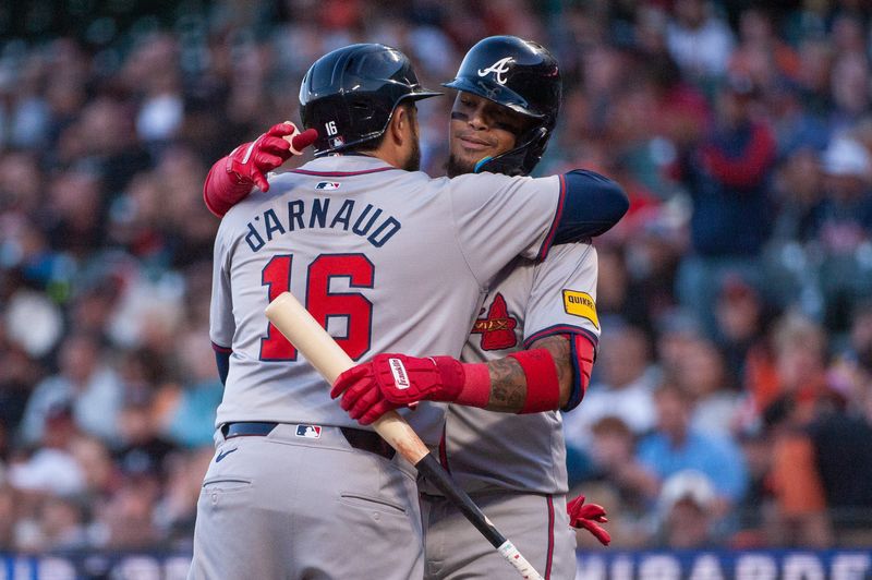 Aug 13, 2024; San Francisco, California, USA;  Atlanta Braves catcher Travis d'Arnaud (16) celebrates with shortstop Orlando Arcia (11) after hitting a home run against the San Francisco Giants during the third inning at Oracle Park. Mandatory Credit: Ed Szczepanski-USA TODAY Sports
