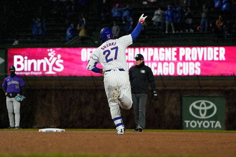 Apr 3, 2024; Chicago, Illinois, USA; Chicago Cubs right fielder Seiya Suzuki (27) hits a home run against the Colorado Rockies during the fifth inning at Wrigley Field. Mandatory Credit: David Banks-USA TODAY Sports