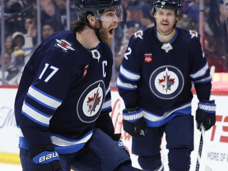 Mar 5, 2024; Winnipeg, Manitoba, CAN; Winnipeg Jets center Adam Lowry (17) celebrates his second period goal  with Winnipeg Jets center Mason Appleton (22) against the Seattle Kraken at Canada Life Centre. Mandatory Credit: James Carey Lauder-USA TODAY Sports